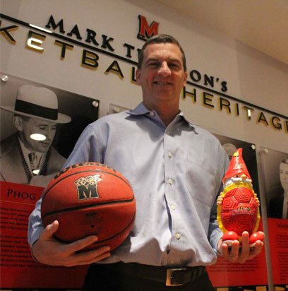 University of Maryland Men's basketball coach, Mark Turgeon, holds the tool of his trade and the gnome for a quick portrait.